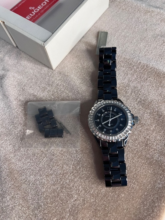 Peugeot black ceramic watch featuring a crystal-set bezel and dial markers. main image 5